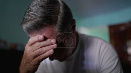 Photo for Depiction of Middle-Aged Man Covering Face in Shame, Displaying Despair and Solitude struggling with problems and worry - Royalty Free Image