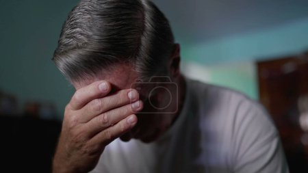 Photo for Depiction of Middle-Aged Man Covering Face in Shame, Displaying Despair and Solitude struggling with problems and worry - Royalty Free Image