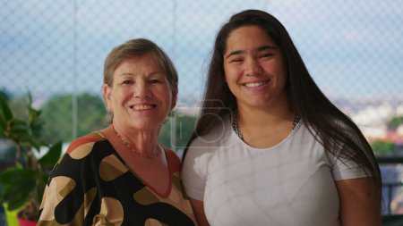 Photo for Confident happy Generational Portrait, Diverse Grandmother and Granddaughter Posed with Assurance, Looking at the Camera - Royalty Free Image