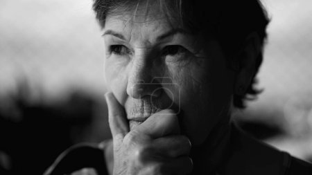 Photo for Thoughtful Senior Woman in Monochrome, Hand on Chin - Royalty Free Image