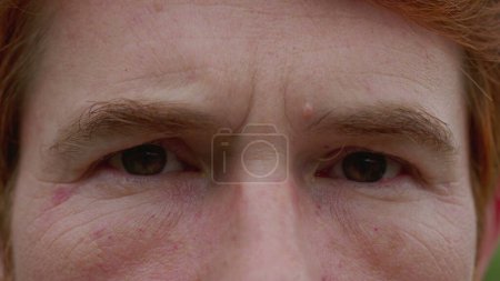 Photo for Man with happy emotion macro close-up eyes. A male person wide smile looking at camera feeling joy and contentment - Royalty Free Image