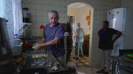 Photo for Senior Friends Engaged in Weekend Routine, Washing and Drying Dishes Post-Lunch, candid domestic everyday lifestyle - Royalty Free Image