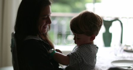 Photo for Candid mother and child together silhouette mom and kid togetherness - Royalty Free Image
