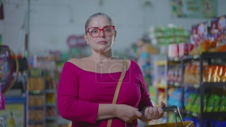 Photo for Middle-Aged Woman Struggling with Inflation Inside Grocery Store, Hard Times Consumer Portrait - Royalty Free Image