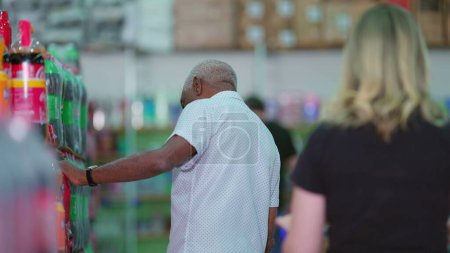 Photo for Consumer Behavior Depicted by Diverse Shoppers in Supermarket Aisle. Candid People shopping at grocery store - Royalty Free Image