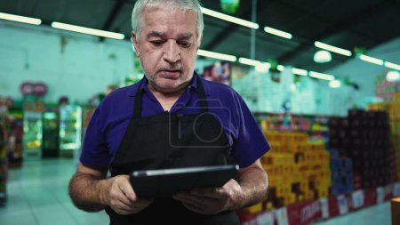 Photo for Stressed business owner of supermarket chain feeling pressure facing difficulties in grocery store operations. Portrait of a frustrated manager with unshaven beard and gray hair - Royalty Free Image