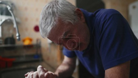 Photo for Elderly Man Struggling with Illness at Home, Defeat and Desperation in Dramatic Scene, senior person facing quiet despair at home in solitude - Royalty Free Image