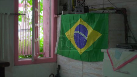 Photo for Patriotic Display in Brazil of a Brazilian Flag hanging by Window - Royalty Free Image