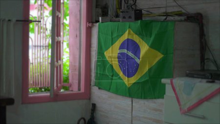 Photo for Patriotic Display in Brazil of a Brazilian Flag hanging by Window - Royalty Free Image