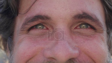 Photo for Happy man with surprise reaction smiling directly at camera in macro close up - Royalty Free Image