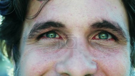 Photo for Male person with GREEN eyes looking at camera in macro closeup - Royalty Free Image