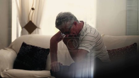 Photo for Anxious neurotic elderly senior man struggles with preoccupation and worry at home alone. Quiet despair in old age concept, suffering from mental illness and the aging process - Royalty Free Image