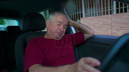 Photo for Anxious senior man inside vehicle interior suffers from worries and regret. Older person remembering trauma struggles with depression and mental illness - Royalty Free Image