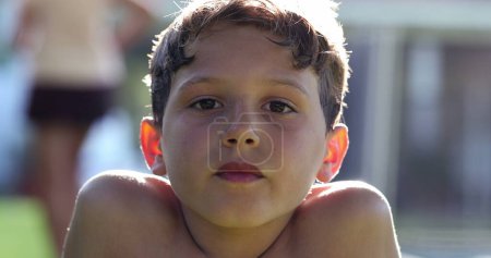 Photo for Boy reacting in shock to news with mouth open. Child looking to camera in disbelief and surprise - Royalty Free Image