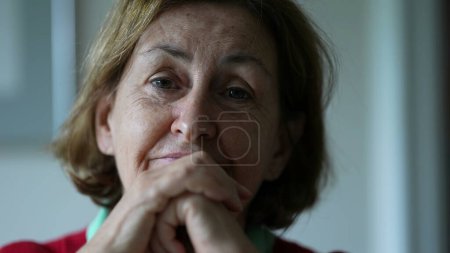 Photo for Older woman leaning in to listen to conversation, close-up face of senior person - Royalty Free Image