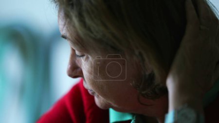 Photo for Senior woman pondering solution, close-up face of elderly lady leaning forward in deep reflection - Royalty Free Image