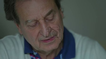 Photo for Senior elderly man close-up face listening to person off-camera, older person nodding yes in affirmation, pays attention to conversation - Royalty Free Image