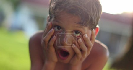 Photo for Child reaction with shock and despair portrait. Kid reacting with horror pulling hair our - Royalty Free Image