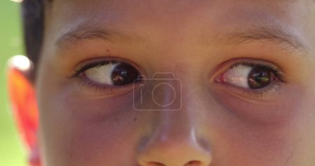 Photo for Child eyes looking sideways right and left feeling anxious. Worried concerned kid macro eyes - Royalty Free Image