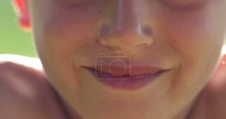 Téléchargez les photos : Upset child boy changing emotion becoming serious. Macro close-up kid lips - en image libre de droit