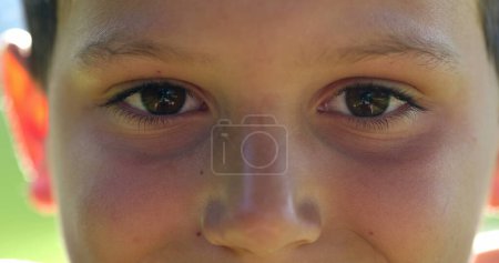 Photo for Kid face close-up closing eyes in meditation. Child boy opening eyes smiling to camera, macro closeup - Royalty Free Image