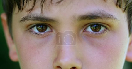 Photo for Serious child boy face eyes macro closeup looking to camera - Royalty Free Image