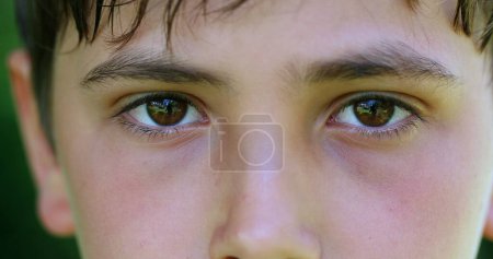Photo for Serious child boy face eyes macro closeup looking to camera - Royalty Free Image