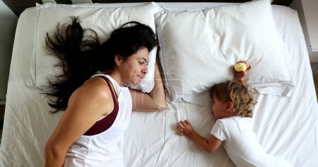 Photo for Happy Mother and baby son relationship in morning bed, top view - Royalty Free Image