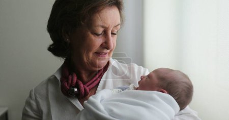 Photo for Grand-mother holding newborn baby - Royalty Free Image