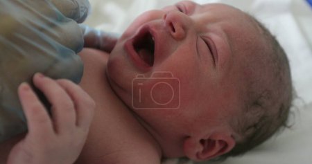 Photo for Infant newborn baby crying, first minutes of life - Royalty Free Image