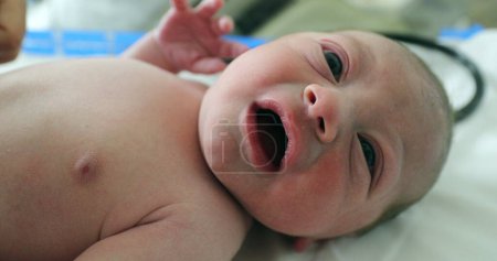 Foto de Beautiful cute small newborn baby after birth - Imagen libre de derechos