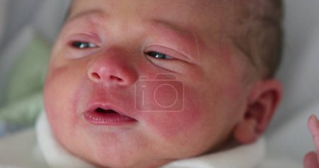 Foto de First day of life of newborn infant baby falling asleep - Imagen libre de derechos