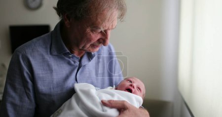 Photo for Grand-father holding newborn baby infant grand-son - Royalty Free Image