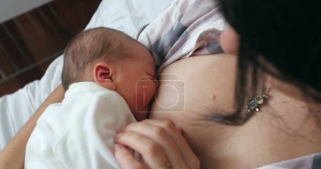 Photo for Newborn baby breastfeeding after birth, first day of life - Royalty Free Image