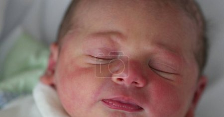 Photo for Newborn baby first day of life waking up opening eyes. Infant toddler wakes up - Royalty Free Image