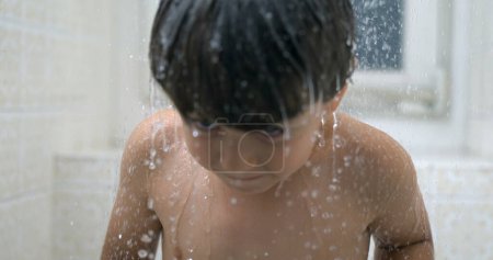 Photo for Water droplets falling into child body in super slow-motion, 1000 fps shot of young boy bath time - Royalty Free Image
