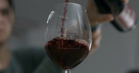 Photo for Wine Waltz - Pour into Glass , Elegant Elixir - Wine Serving Captured - Royalty Free Image