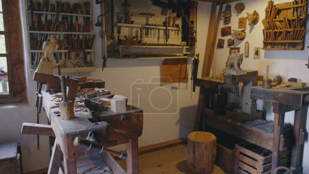 Photo for Traditional wooden atelier at rural farmhouse, bricolage handmade equipment and tools, ancient carpentry shop - Royalty Free Image