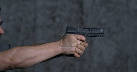 Photo for Close-up pistol Stoeger STR-9 Striker Fired 9mm, single shot at shooting range in super slow-motion 800 fps - Royalty Free Image