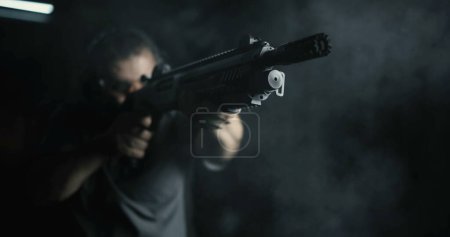 Photo for Front View of Man Firing Shotgun, 800fps Super Slow-Motion, High-Speed Powerful Weapon Shooting - Royalty Free Image
