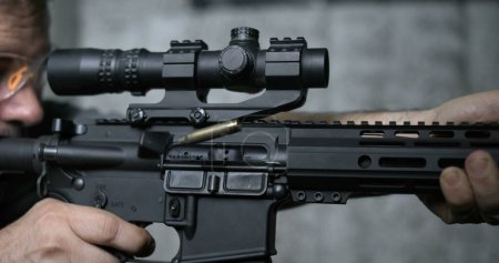 Photo for Detail Close-Up of Finger Pulling Trigger on Assault Rifle, Multipel shots in Super Slow-Motion 800 fps - Royalty Free Image
