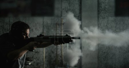 Photo for Profile Man Firing Shotgun Captured in 800fps Super Slow-Motion, High-Speed Shooting with speed-ramp - Royalty Free Image