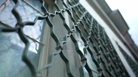 Photo for Metal Fence Design - Window Protection Patterns on Building Facade - Royalty Free Image