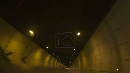 Photo for Driving inside tunnel with lights shining in ceiling, speed transportation concept - Royalty Free Image