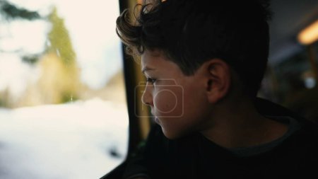 Photo for Drifting Daydreams scene of Pre-Teen Boy Gazing from Train Window - Royalty Free Image