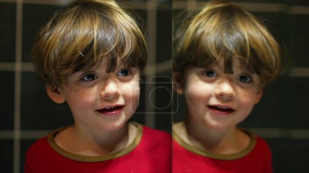 Photo for Small boy mirror reflection on bathroom mirror, playful kid looking at his own duplicate - Royalty Free Image