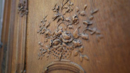 Photo for Ancient Door Elegance, Handcrafted Floral Motif on Wood. Floral Mastery on Wood, Timeless Handmade Door Ornamentation - Royalty Free Image