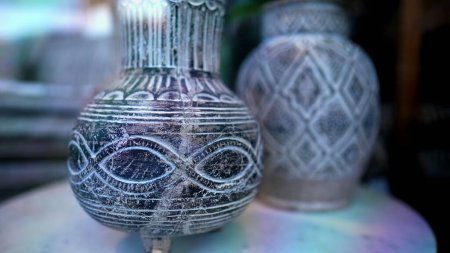 Photo for Intricate Ceramic Detail Traditional Vase in Focus on display behind glass. Handcrafted Beauty - Royalty Free Image