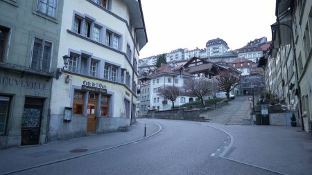 Photo for Fribourg, Switzerland Circa March 2022 - Quaint Street Scene in Traditional Fribourg Swiss Town, Picturesque Authentic Street Charm - Royalty Free Image