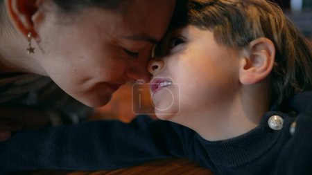 Photo for Cute afectionate moment between mother and child doing eskimo kiss, facing nose to nose - Royalty Free Image